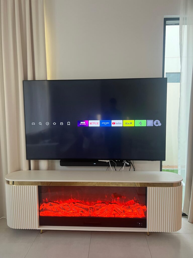 White and gold electric fireplace TV console with LED flame display and heater design 4